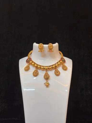 Traditional Lakshmi pendant | premium green and ruby red stone  design | gold-plated necklace set | ethnic, temple  type